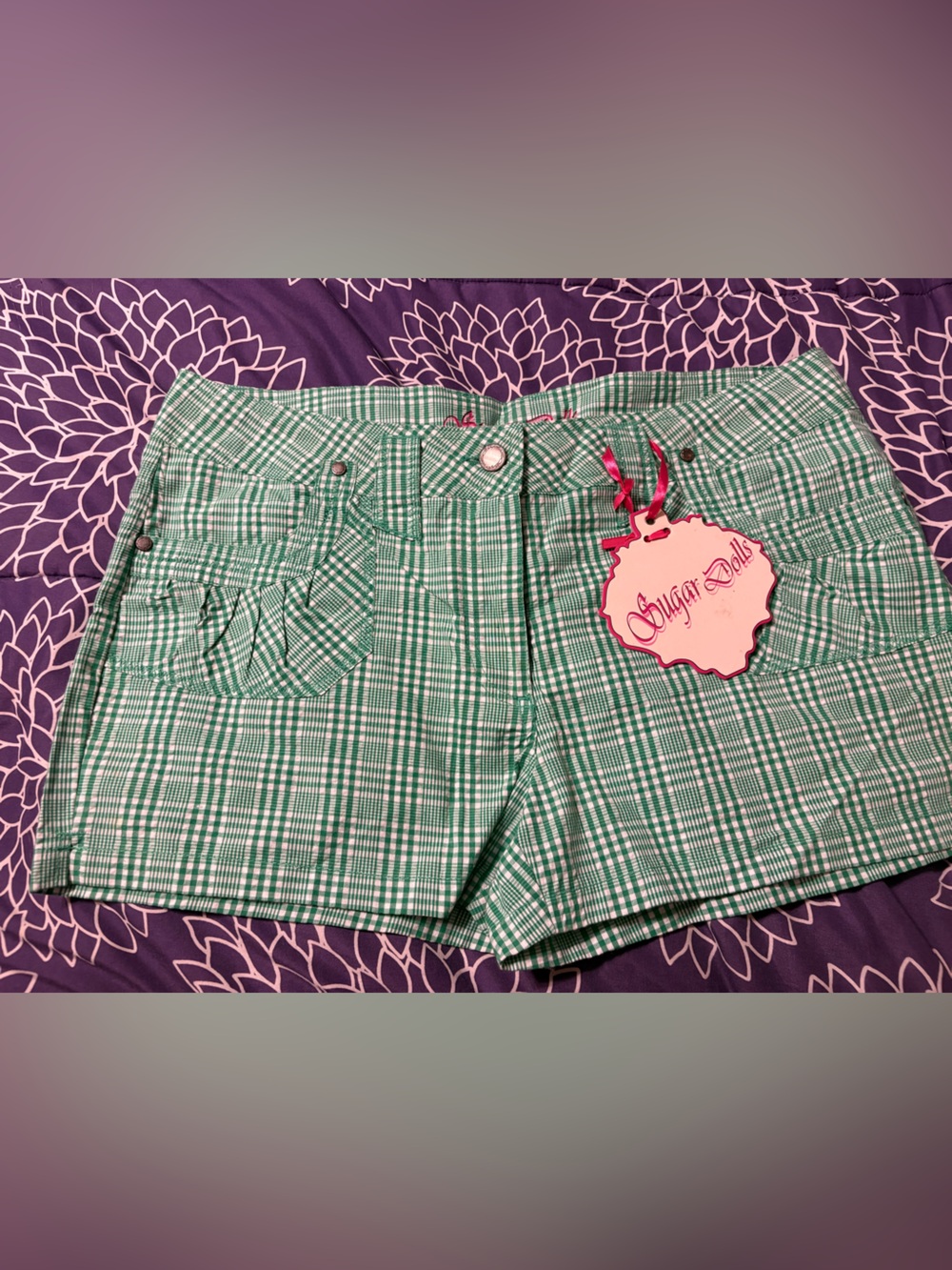 Sugar Dolls green and white gingham patterned shorts with a decorative tag